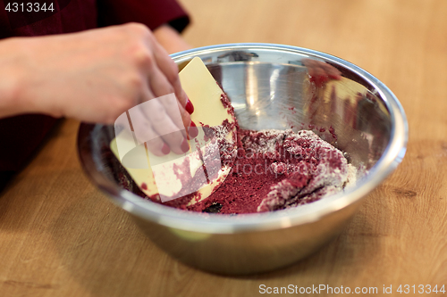 Image of chef making macaron batter at confectionery