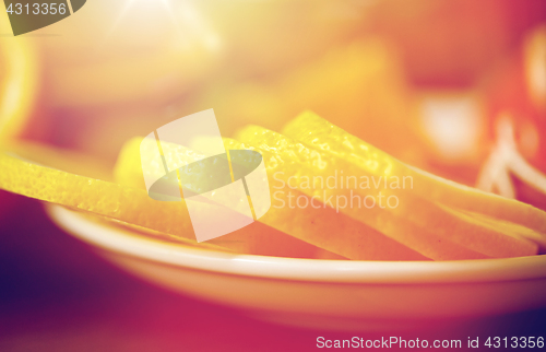 Image of close up of lemon slices on plate