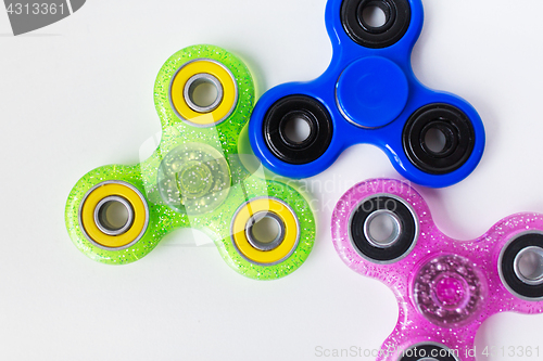 Image of close up of fidget spinners on white background