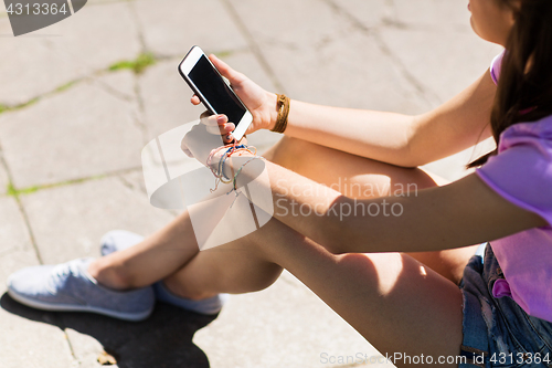 Image of close up of woman or teenage girl with smartphone