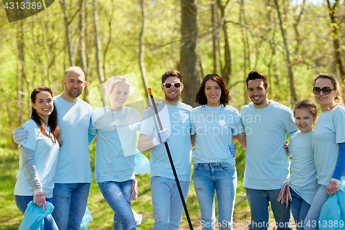 Image of group of volunteers with garbage bags in park