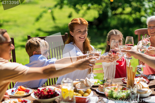 Image of happy family having dinner or summer garden party