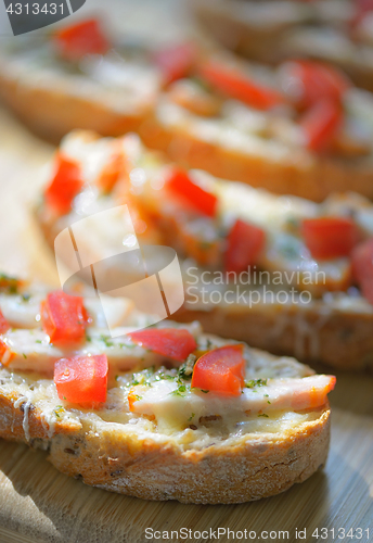 Image of Bruschetta with tomato and chicken 