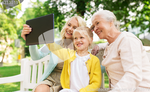 Image of mother, daughter and grandmother with tablet pc