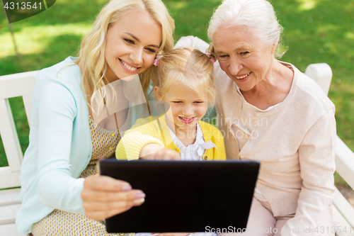 Image of mother, daughter and grandmother with tablet pc