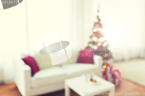 Image of blurred living room with christmas tree background
