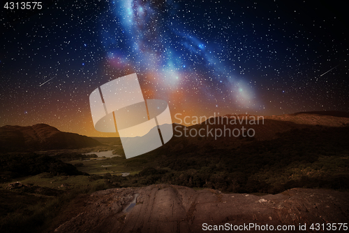 Image of mountain landscape over night sky or space