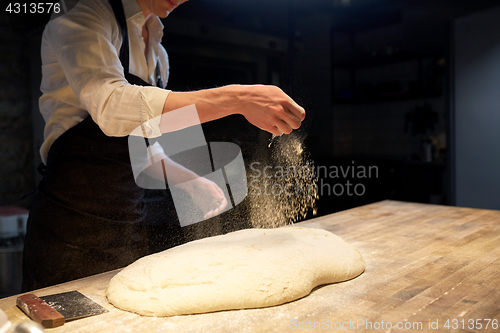 Image of chef or baker making bread dough at bakery