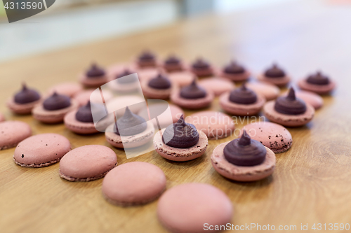 Image of macarons on table at confectionery or bakery