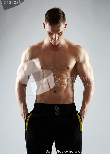 Image of young man or bodybuilder with bare torso