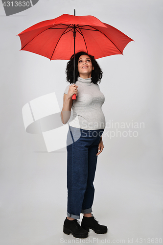 Image of Pregnant woman standing in full length
