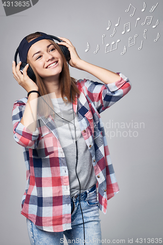 Image of Teen girl listening enjoying music