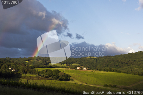 Image of Evening landscape with rainbow. Tuscany, Italy