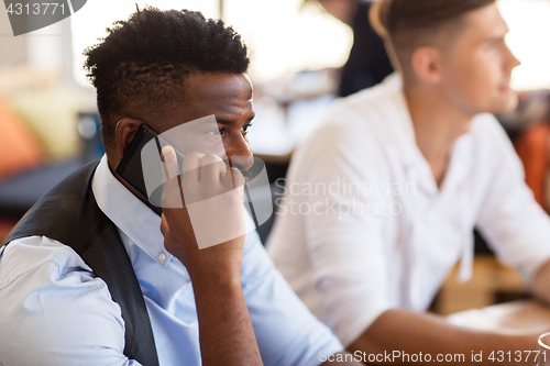 Image of man calling on smartphone at bar or restaurant