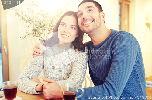 Image of happy couple drinking tea at restaurant