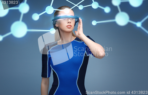 Image of woman in virtual reality 3d glasses with molecules