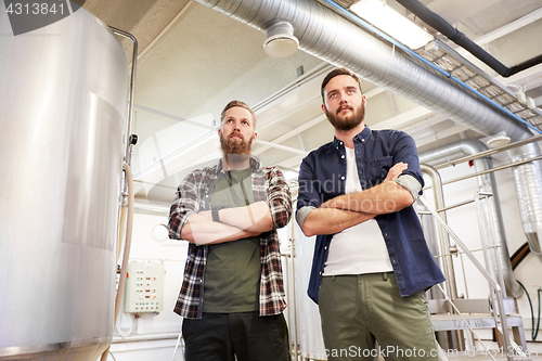 Image of men at craft brewery or beer plant