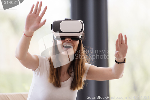 Image of woman using VR-headset glasses of virtual reality