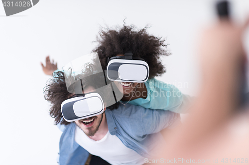 Image of multiethnic couple getting experience using VR headset glasses