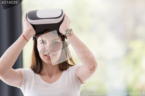 Image of woman using VR-headset glasses of virtual reality