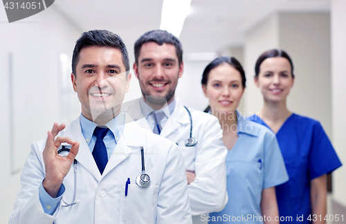 Image of group of happy medics or doctors at hospital