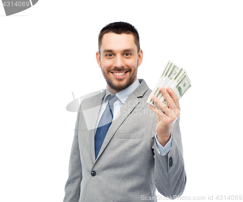 Image of smiling businessman with american dollar money