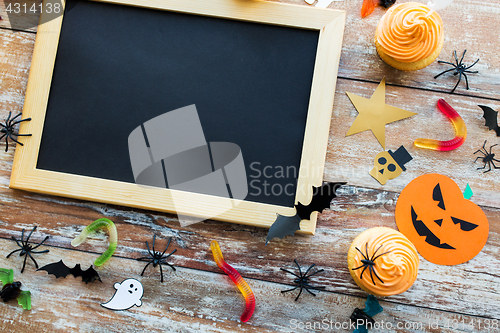 Image of blank chalkboard and halloween party decorations