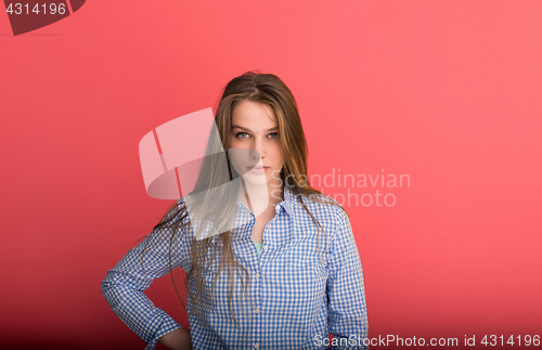 Image of woman playing with her long silky hair