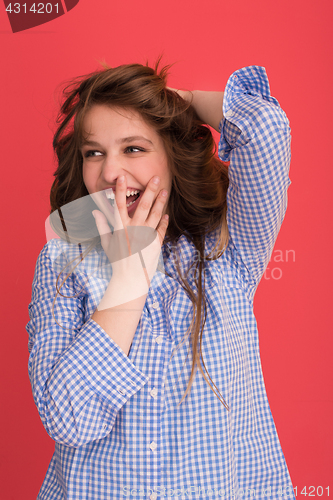 Image of woman playing with her long silky hair