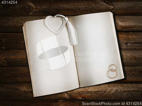 Image of open book with heart bookmark