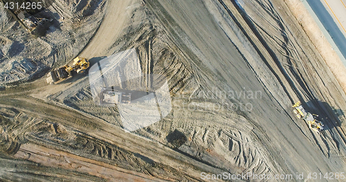 Image of Aerial View Of Tractors On A Construction Site