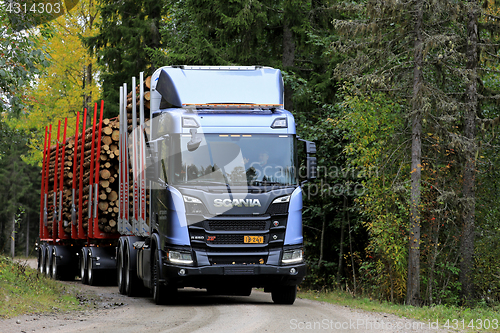 Image of Scania R650 XT Logging Truck on Forest Road