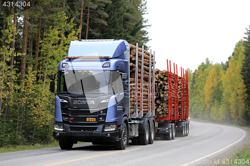 Image of Scania R650 XT Logging Truck on Autumn Road