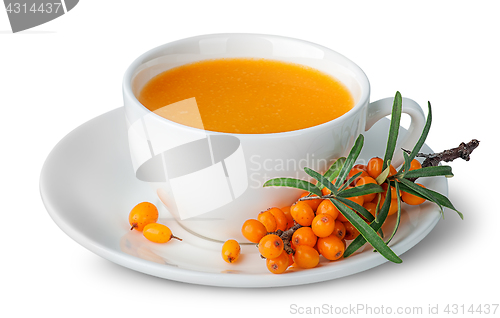 Image of Juice from sea-buckthorn in a cup with berries