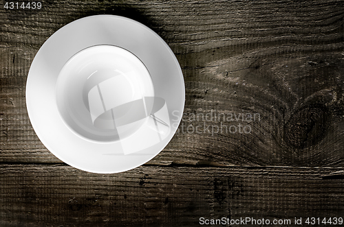 Image of Empty coffee cup on wooden table