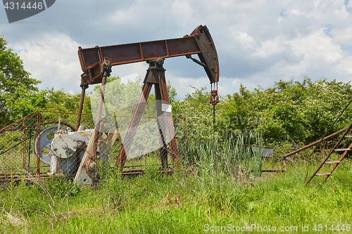 Image of Oil well on a landscape