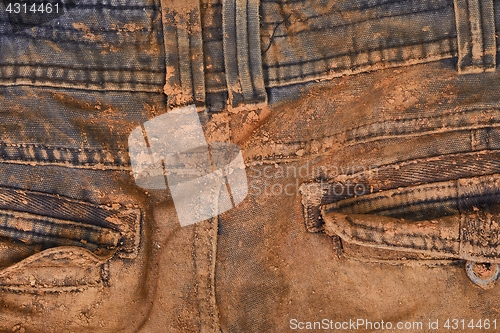 Image of Trousers with mud