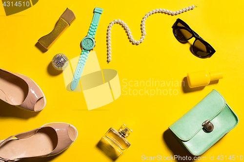 Image of Still life of fashion woman, objects on yellow