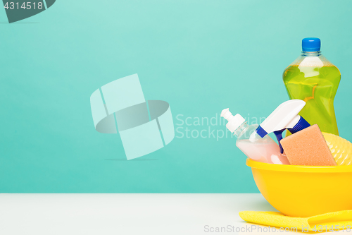 Image of Various bottles with cleaning supplies on colored background