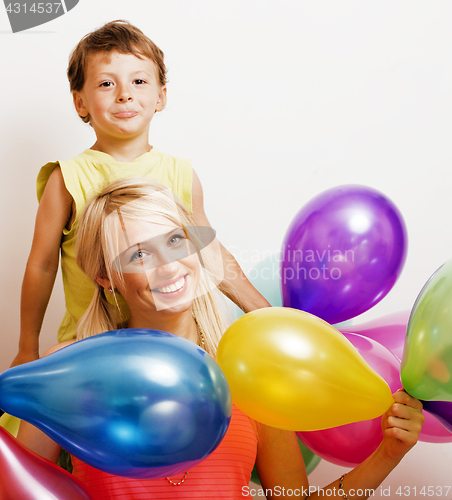 Image of pretty family with color balloons on white background, blond woman with little boy on birthday party