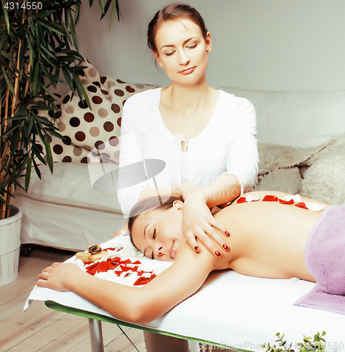 Image of stock photo attractive lady getting spa treatment in salon, heal