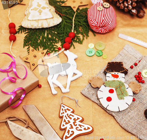 Image of lot of stuff for handmade gifts, scissors, ribbon, paper with countryside pattern, ready for holiday concept, nobody home 