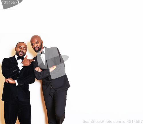 Image of two afro-american businessmen in black suits emotional posing, g