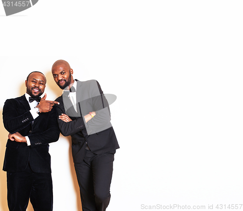 Image of two afro-american businessmen in black suits emotional posing, g
