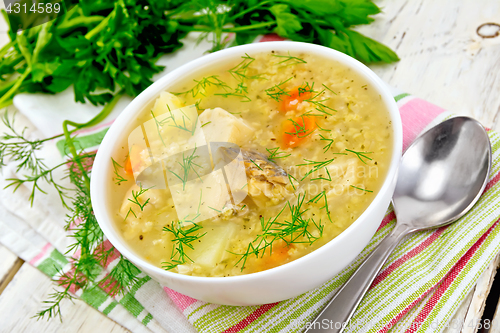 Image of Soup fish with millet on light board