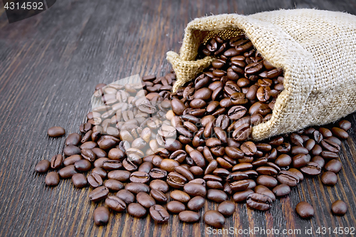 Image of Coffee black grain in bag on board