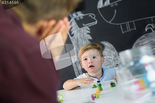 Image of Cute little toddler boy at child therapy session.