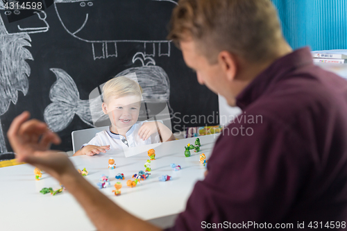 Image of Cute little toddler boy at child therapy session.