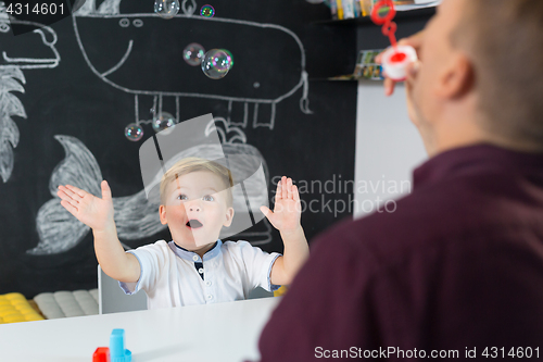 Image of Cute little toddler boy at child therapy session.