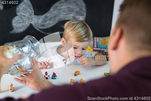 Image of Cute little toddler boy at child therapy session.